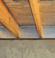 SilverGlo™ insulation installed in a floor joist in Newport