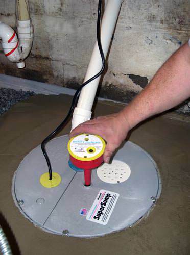 A newly installed sump pump system in a basement in Athol