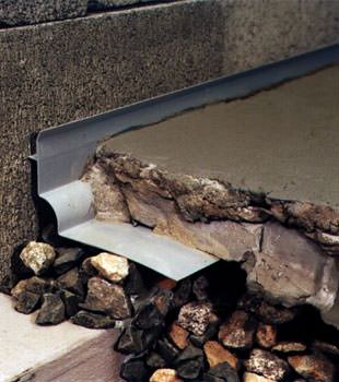 a custom designed basement drain system for thin basement floors in Fairchild Air Force Base.