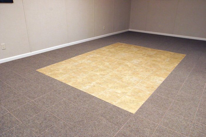 tiled and carpeted basement flooring installed in a Sandpoint home