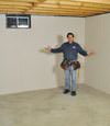 Veradale basement insulation covered by EverLast™ wall paneling, with SilverGlo™ insulation underneath