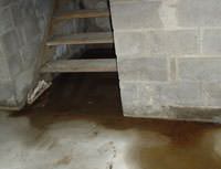 Water Pouring into a Nine Mile Falls Basement through Hatchway Doors